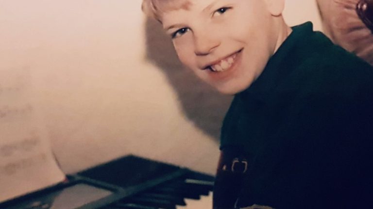 Young Gary Parsons playing keyboard